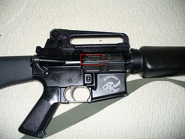 AR 15, dust cover open, showing ridges on bolt